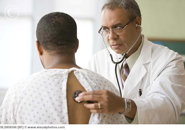 African male doctor examining patient